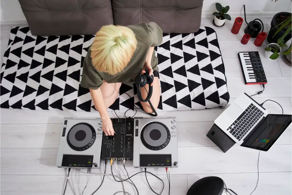 Woman adjusting her dj console