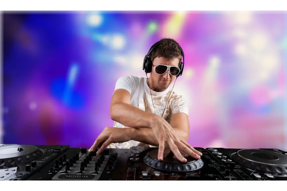 Portrait of confident young DJ with headphones