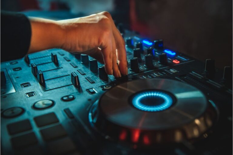 DJ Hands creating and regulating music on dj console mixer i