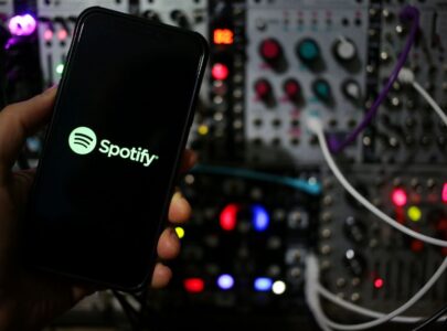 Dj producer artist at studio plans to upload his music at the popular streaming platform Spotify