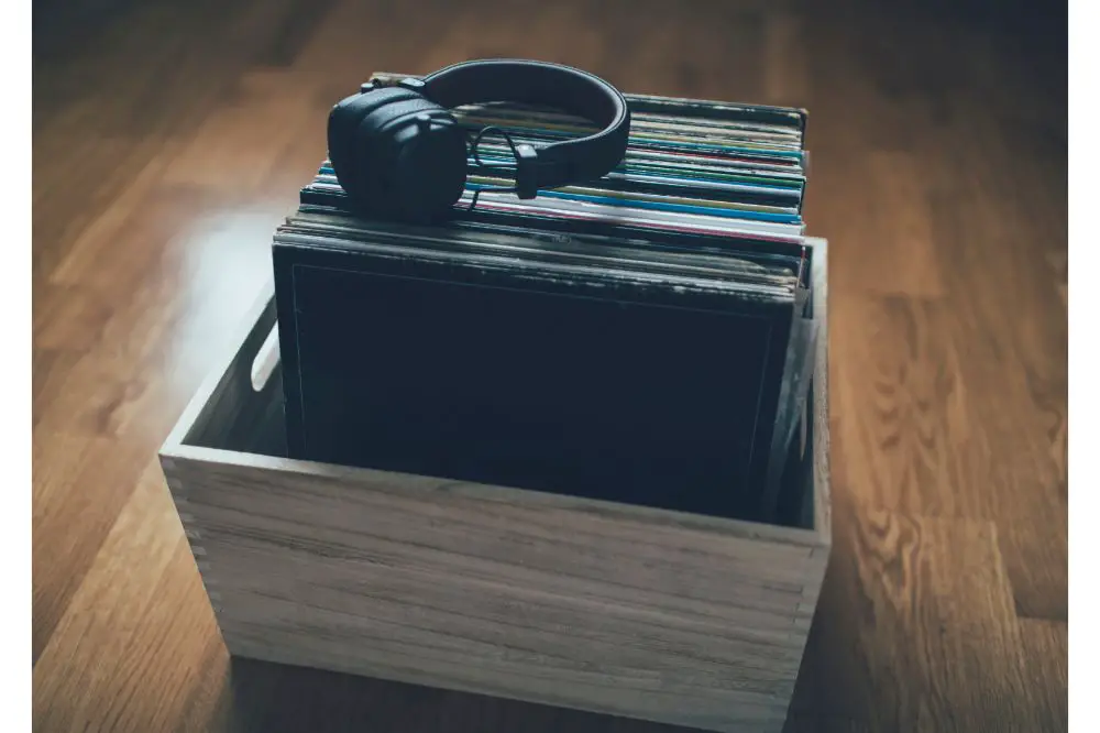 Headphones on stack of the vinyl records collection